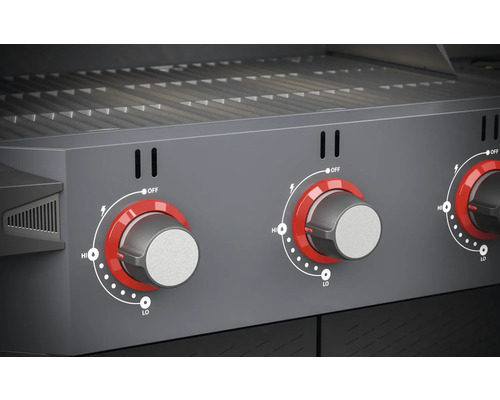 Gros plan d''un barbecue à gaz avec trois boutons rotatifs pour le contrôle de la température