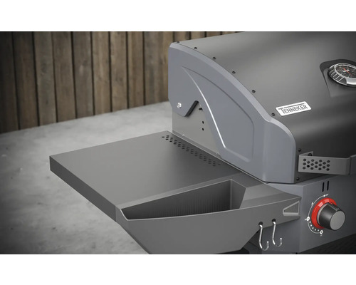 Vue détaillée d''un barbecue à gaz avec surface de rangement et barre à crochets