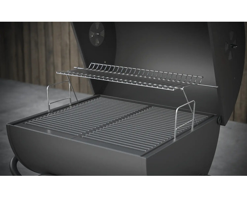 Barbecue à charbon de bois ouvert avec grille de cuisson