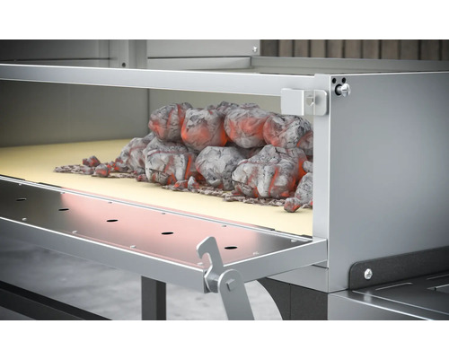 Barbecue avec du charbon de bois dans la cheminée d''allumage