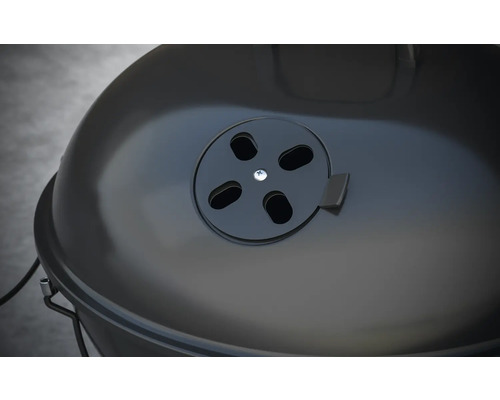 Vue détaillée d''un barbecue boule avec curseur de ventilation sur le couvercle