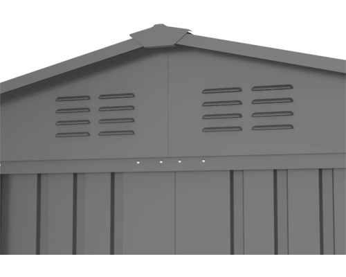 Vue détaillée d''un abri de jardin avec des fentes d''aération dans la zone du pignon.
