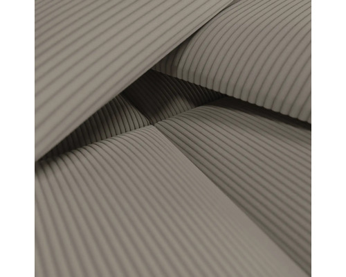 Gros plan d''un tissu d''ameublement avec motif côtelé