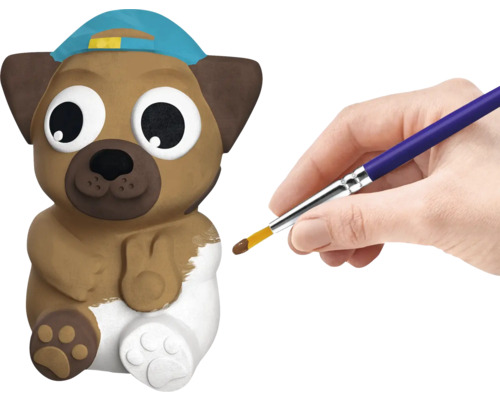 Peindre une figurine de chien avec un pinceau