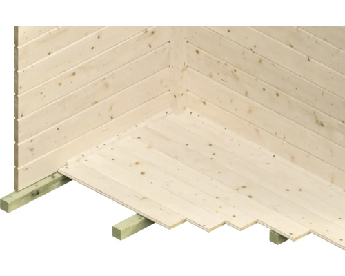 Angle d''un mur en bois avec assemblage rainure et languette et plancher en bois sur poutres