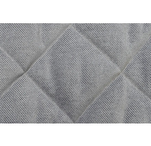Gros plan d''un tissu d''ameublement matelassé avec motif losanges
