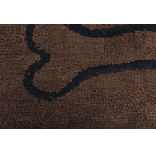 Gros plan d''un tapis marron avec motif d''os