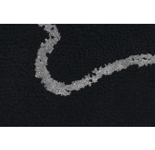 Vue détaillée d''un tapis de bain noir avec un motif clair