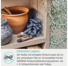 Tuyau textile Gardena avec lance sur étagère en bois