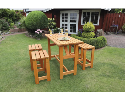 Ensemble de table de bar en bois avec deux tabourets dans le jardin