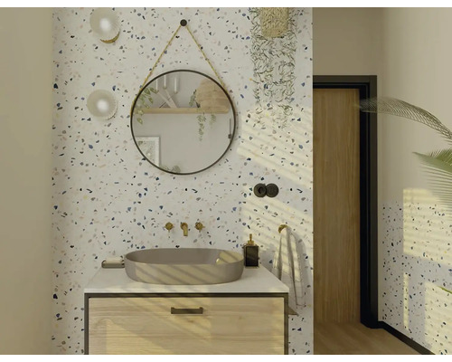 Salle de bain lumineuse avec meuble-lavabo, miroir rond et papier peint terrazzo