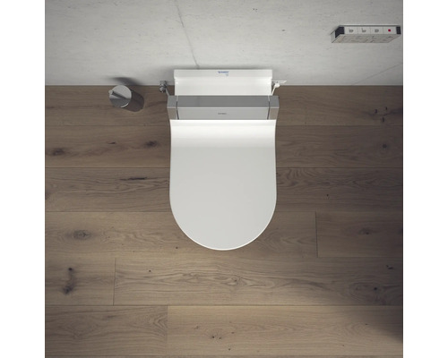 Dusch-WC mit Fernbedienung und Toilettenpapierhalter im Badezimmer