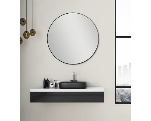 Salle de bains moderne avec miroir rond, vasque à poser et meuble sous-vasque