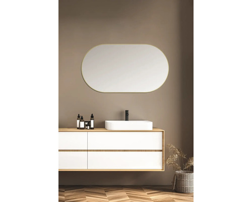 Salle de bains lumineuse avec meuble-lavabo, vasque à poser, miroir ovale et parquet