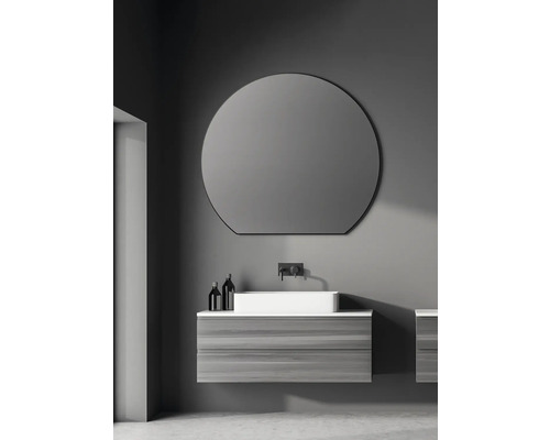 Modernes Badezimmer mit rundem Spiegel, Waschbecken und Unterschrank