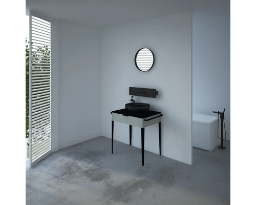 Salle de bain moderne avec meuble-lavabo, miroir rond et baignoire îlot