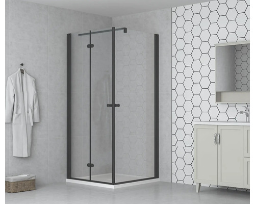 Salle de bains avec cabine de douche à porte pivotante, meuble-lavabo et carreaux hexagonaux