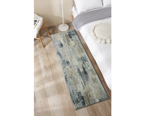 Tapis décoratif dans une chambre à coucher à côté du lit