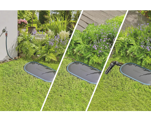 Boîtier de raccordement d''eau Gardena Pipeline dans le jardin avec des fleurs et du gazon