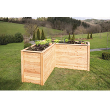 Jardinière en bois dans le jardin plantée de légumes