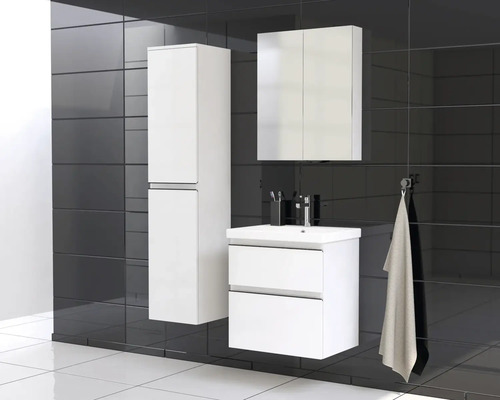 Ensemble de salle de bains moderne avec meuble sous-lavabo, armoire de toilette et armoire haute sur fond de carreaux sombres