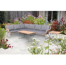 Ensemble de salon de jardin avec canapé d''angle, table et table d''appoint dans un jardin fleuri