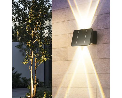 Solar Wandleuchte mit Lichtstrahlen an einer Hauswand