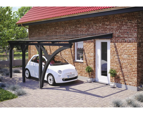 Einzelcarport SKAN HOLZ Eifel inkl. 1 Einfahrtsbogen, Pfostenanker 300 x 541 cm anthrazit Carport aus Holz mit einem darunter geparkten Auto vor einem Haus