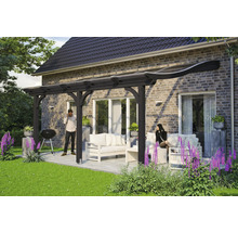 Terrasse couverte avec mobilier de salon et barbecue