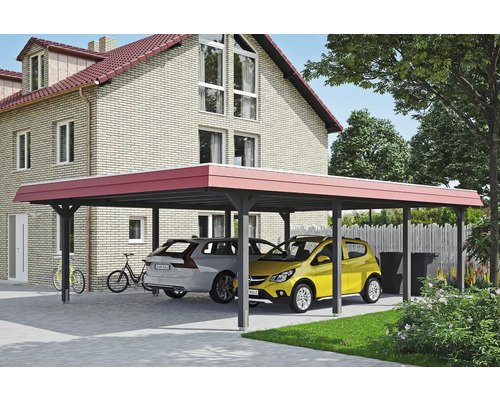 Carport mit zwei geparkten Autos vor einem Haus