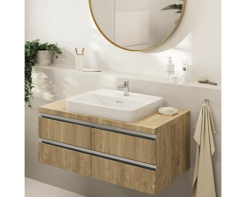 Badezimmer Waschbecken mit Holzunterschrank und rundem Spiegel