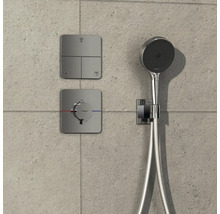 Ensemble de douche avec thermostat et éléments de commande pour différentes fonctions de douche.