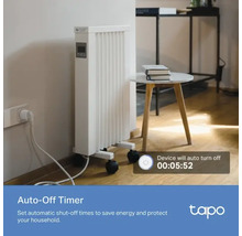 Radiateur mobile blanc avec minuterie et roulettes dans un espace de vie