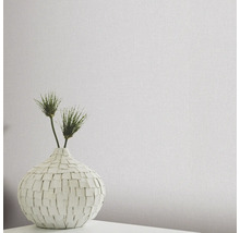 Textiltapete mit Leinenstruktur und Vase mit Dekoration