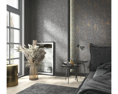 Chambre avec lit, tables de chevet, lampe et décoration murale dans un design moderne.