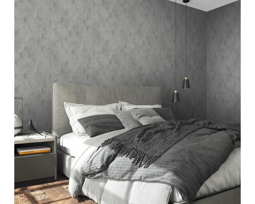 Chambre avec lit, table de chevet et panneaux muraux en forme d''hexagone