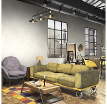 Wohnzimmer im Loftstil mit Sofa, Sessel und Couchtisch