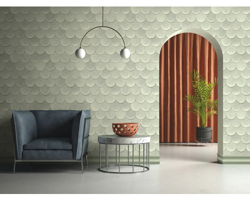 Pièce lumineuse avec fauteuil, table, plante d''intérieur et carrelage mural en écaille