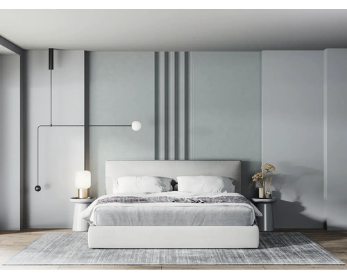 Schlafzimmer mit Bett, Nachttischen, Lampe und Teppich