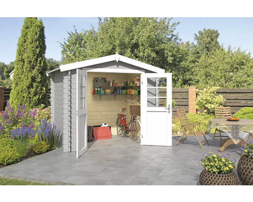 Abri de jardin Outdoor Life Ingo 262,1 x 195 cm gris clair Scène de jardin avec abri de jardin, vélo et table de jardin sur terrasse