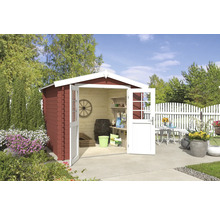 Abri de jardin en bois avec portes doubles ouvertes, entouré de parterres de fleurs et d''une clôture blanche.