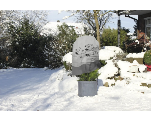 Housse de protection des plantes avec motif d''oiseau dans un jardin enneigé