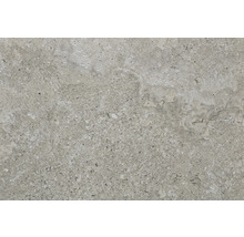 Gros plan d''un carreau gris à la texture mouchetée.