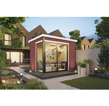 Abri de jardin moderne avec porte coulissante dans un jardin verdoyant