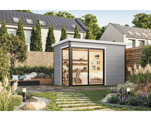 Jardin avec cabanon de jardin moderne et allée aménagée