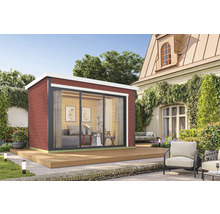 Abri de jardin moderne avec porte coulissante et terrasse dans le jardin.