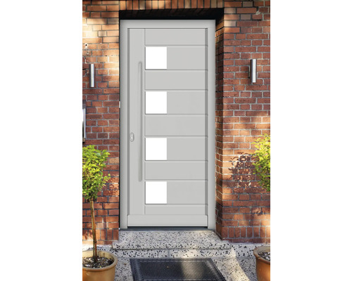 Porte d''entrée moderne avec inserts en verre et poignée en acier inoxydable dans un mur en briques
