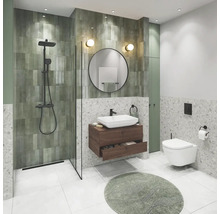 Salle de bain moderne avec douche, lavabo, miroir et toilettes.