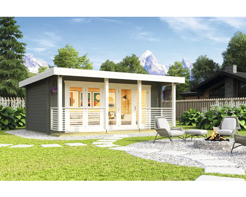 Jardin avec une maison de jardin moderne, terrasse, coin salon et foyer.