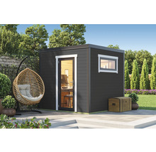 Abri de jardin moderne avec fenêtre et porte dans un jardin soigné.